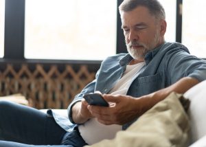 man looking at phone